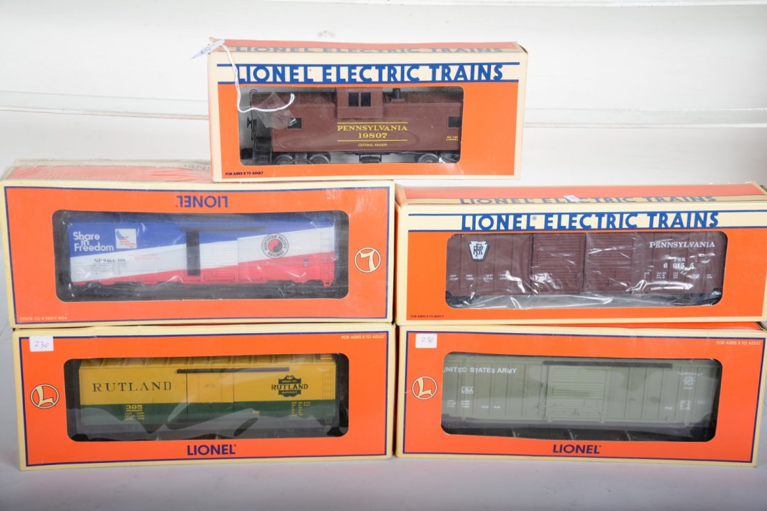 Lionel Freight Cars: Includes 19807 PRR smoke caboose; 17265 US Army boxcar; 29259 NP boxcar; 17216 PRR boxcar; 19552 Rutland boxcar. All appear new with boxes, C10