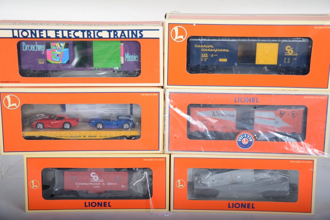 Lionel Freight Cars: Includes 26553 C&O caboose; 25003 WP boxcar; 19271 Minnie Mouse boxcar; 17527 flat with Vipers; 36225 C&O boxcar; 16969 flat with airplane. All appear new in boxes, C10