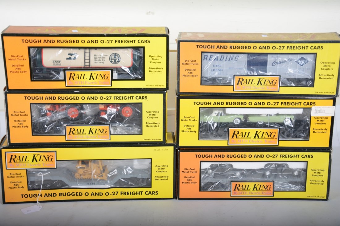 MTH RailKing Freight Cars: Includes Auto-Loaders- 30-7661; 30-7613; 30-7642; 307618 flat with dozer; 30-7373 BNSF tank car; 30-74538 Reading boxcar. All appear new in boxes, C10
