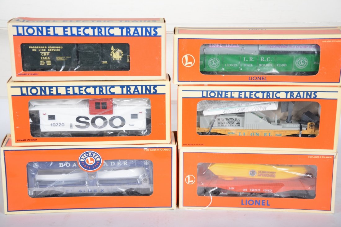 Lionel Freight Cars: Includes 19966 LRRC coil car; 19720 SOO caboose; 7404 JC boxcar; 29413 Airex boat-loader; 16970 flat with boat. All appear new in boxes, C10