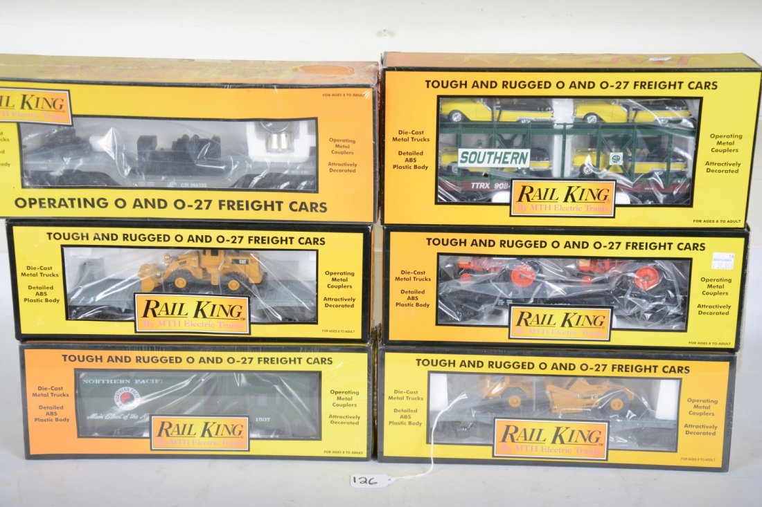 MTH RailKing Freight Cars: Includes 30-7642 flat with Case tractors; 30-7619 flat with loader; 30-76140 flat with Pontiacs; 30-7926 searchlight; 30-7616 flat with earth movers; 30-7725 NP caboose. All appear new in boxes, C10