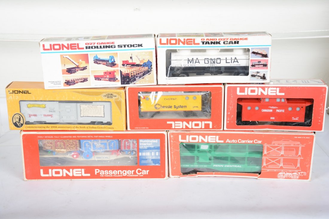 Lionel Freight Cars: Includes a NO Photo 9854 BR reefer, white, C9; 9431 JLC boxcar; 9167 Chessie caboose; 9165 CP caboose; Coles circus flat in incorrect box, some broken cage wheels, C6; 9364 crane; 9279 Magnolia tank; 