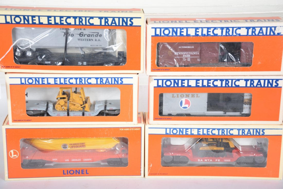 Lionel Freight Cars: Includes 9485 Anniversary boxcar; 16970 flat with operating boat; 16955 flat with Challenger; 16374 DRGW trailer flat, ob dented; 9456 PRR boxcar; 16935 UP flat with dozer. All appear unrun with boxes