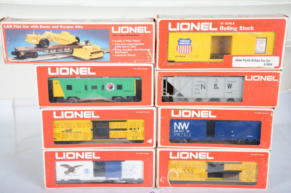 Lionel MPC Freight Cars: Includes 9121 Flat with dozer & scraper; 9779 1976 TCA boxcar; 9771 N&W boxcar; 9113 N&W hopper; 9606 UP hi cube; 9773 NYC stock car; 9725 MKT cattalo; 9177 NP caboose. Some show very light runtime wi