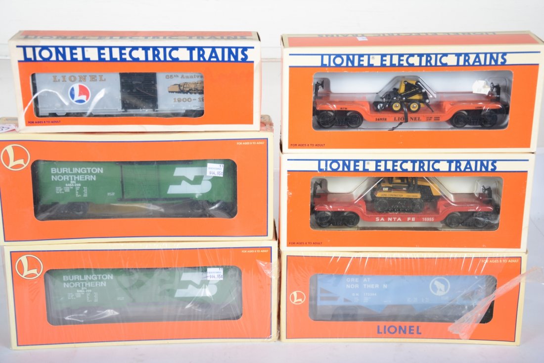 Lionel Freight Cars: Includes 9484 Anniv boxcar; 2 #29251 BN boxcars; 16955 SF flat with Challenger; 16443 GN hopper; 16958 flat with loader. All appear new in boxes, C10