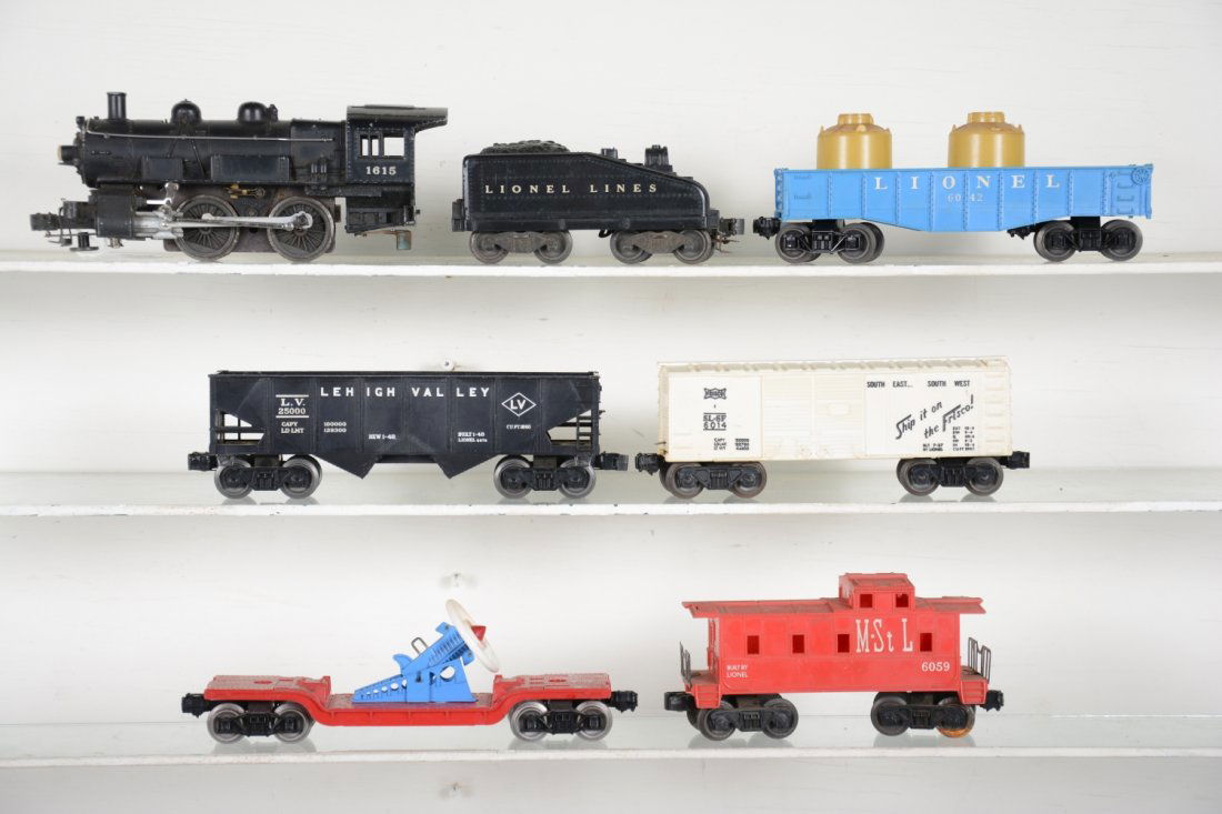 Lionel Postwar Train Set: Includes a 1615 steam switcher, 1 broken running light; 1615 tender; 6476 hopper; 3309 turbo missile launcher; 6014 Frisco boxcar; 6042 gondola; 6056 M&StL caboose. All show moderate playwear, C6-7