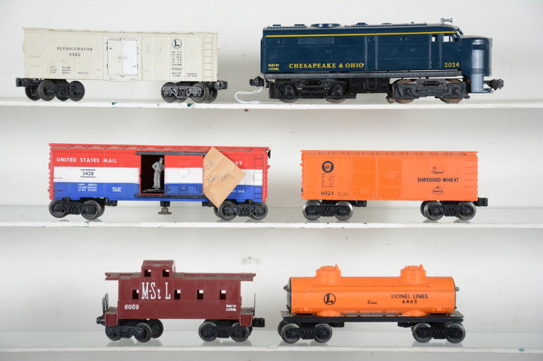 Lionel 2024 diesel Freight Set: Includes a 2024 C&O Alco A diesel, hairline crack in cowl; 6482 reefer; 3428 operating mail car with bag; 6465 tank car; 6024 Shredded Wheat boxcar; 6059 M&StL caboose. All show light to moderate play