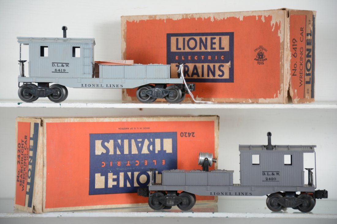 LN Boxed Lionel 2420 & 6419 Cabooses: Includes a 6419-25 work caboose with insert and inspection label, ob has surface damage; 2420 searchlight work caboose, minor light oxidation on wheels, with insert & stained box. Both are unrun, othe