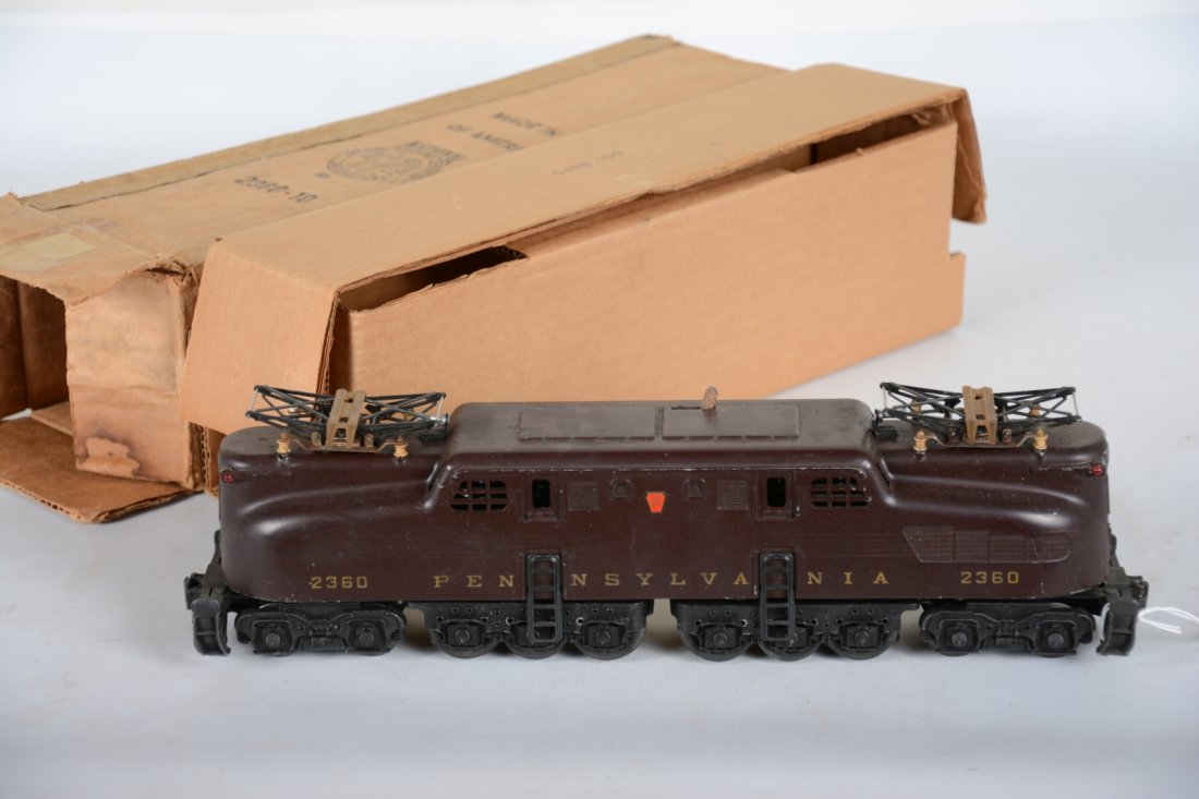 Boxed Lionel 2340 PRR GG1 Electric: Tuscan 5-stripe loco, stripes are 25%, decals 98%; battery box is clean and shows moderate playwear with 2360-10 box dated 1956, paint is C6