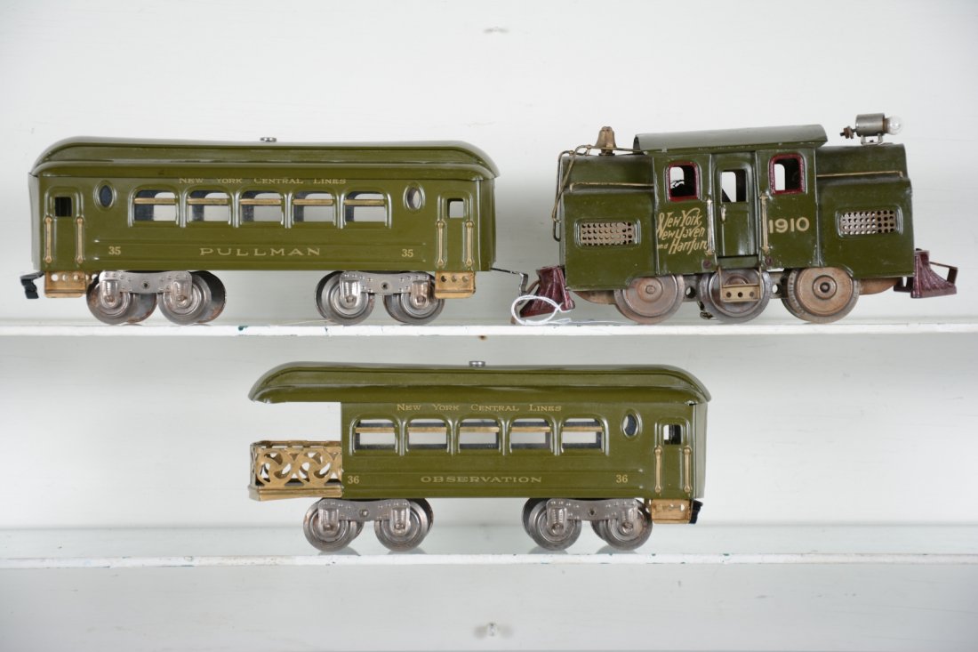 Restored Lionel MFG 1910 Set: Standard Gauge. Circa 1912. Includes a 6-wheel 1910 center cab electric with 35 Pullman; 36 Observation, both with ribbed sides. All professionally restored with satin finish.