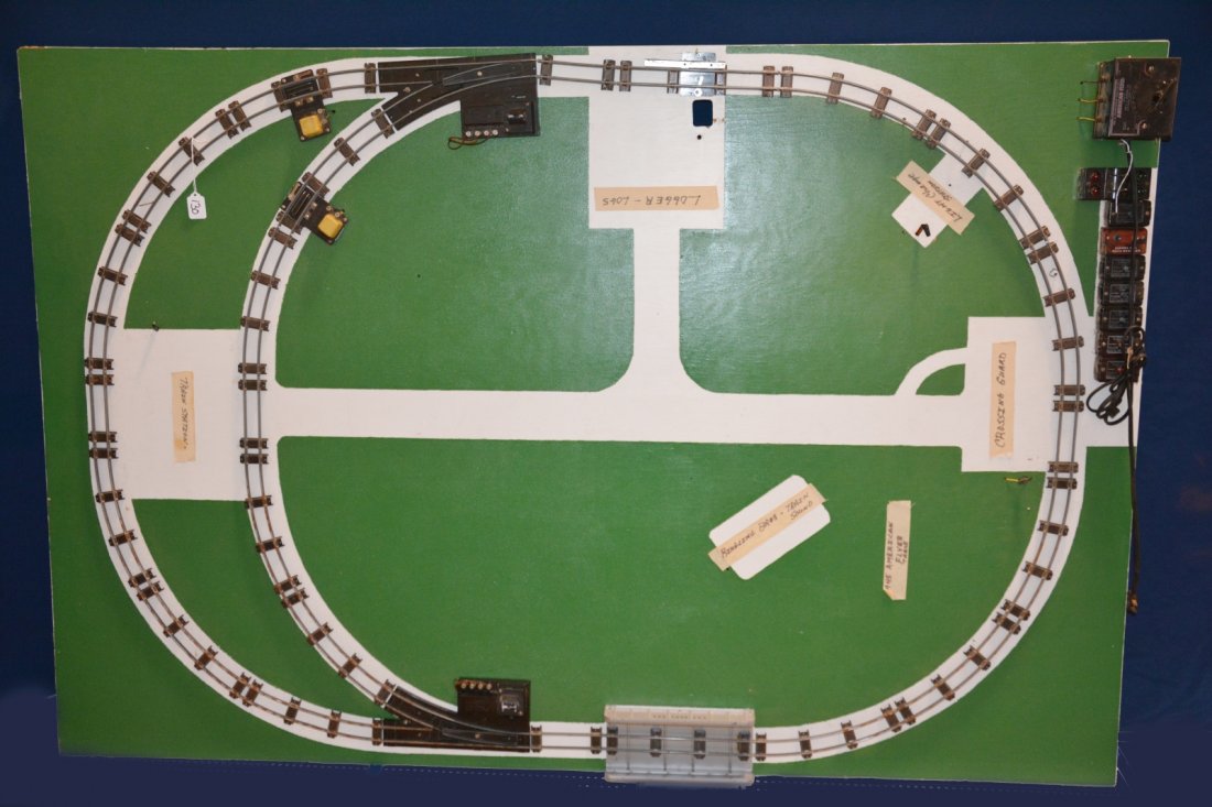 1940s American Flyer Factory Layout: S gauge. 4X6', painted wood. This restored factory layout was originally made in the late 1940s. The 1948 version came with a set of white display shelves attached to the back. The restored pattern is