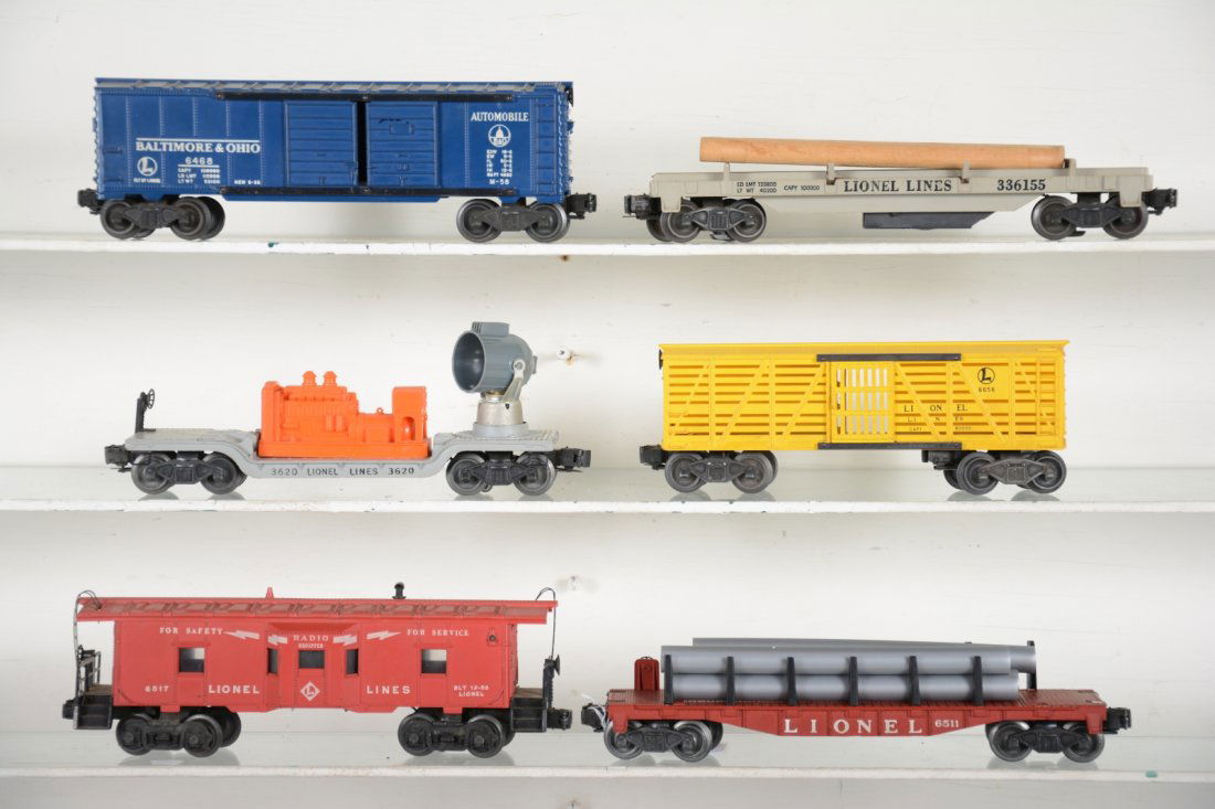 Lionel Freight Cars: Includes 6517 bay window caboose; 6511 flat with repro pipes; 6656 stock car; 3620 searchlight; 3661 log dump; 6468 B&O boxcar. All show light to moderate playwear, C7-7+