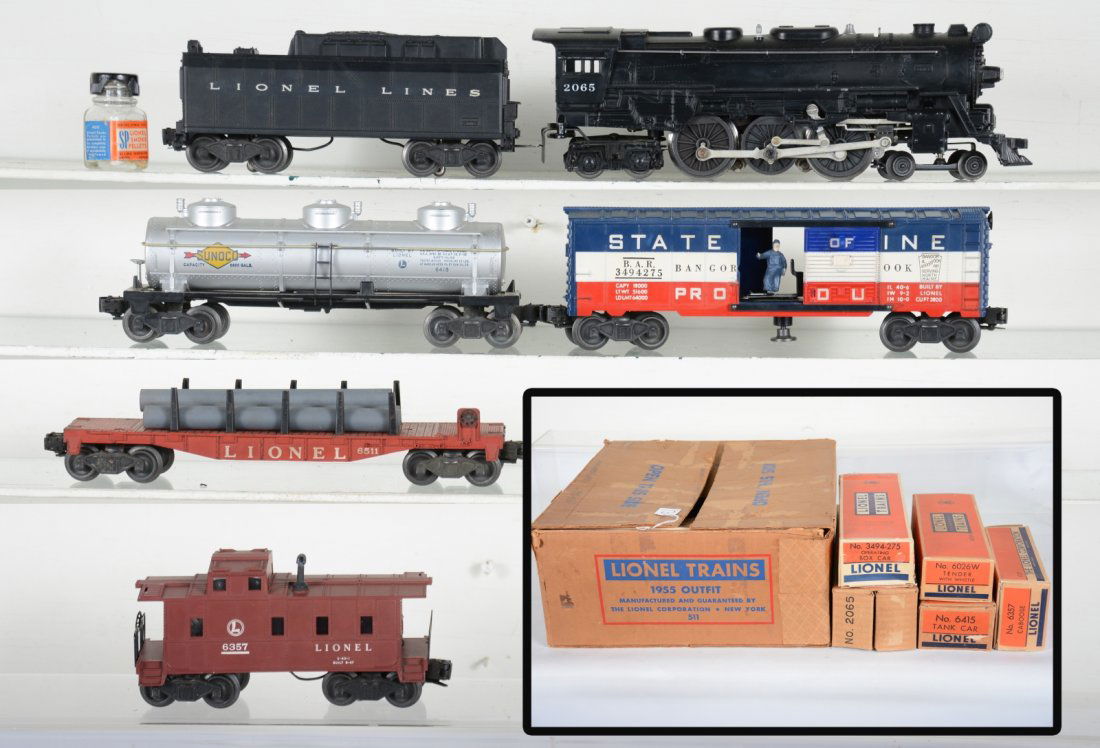 Boxed Lionel Set 511: Circa 1955. Includes a 2065 steam loco; 6026W tender; 3494-275 SOM operating boxcar; 6511 flat with pipes; 6415 Sunoco tank car; 6357 caboose. All are clean with boxes, except 6511, with track and a c