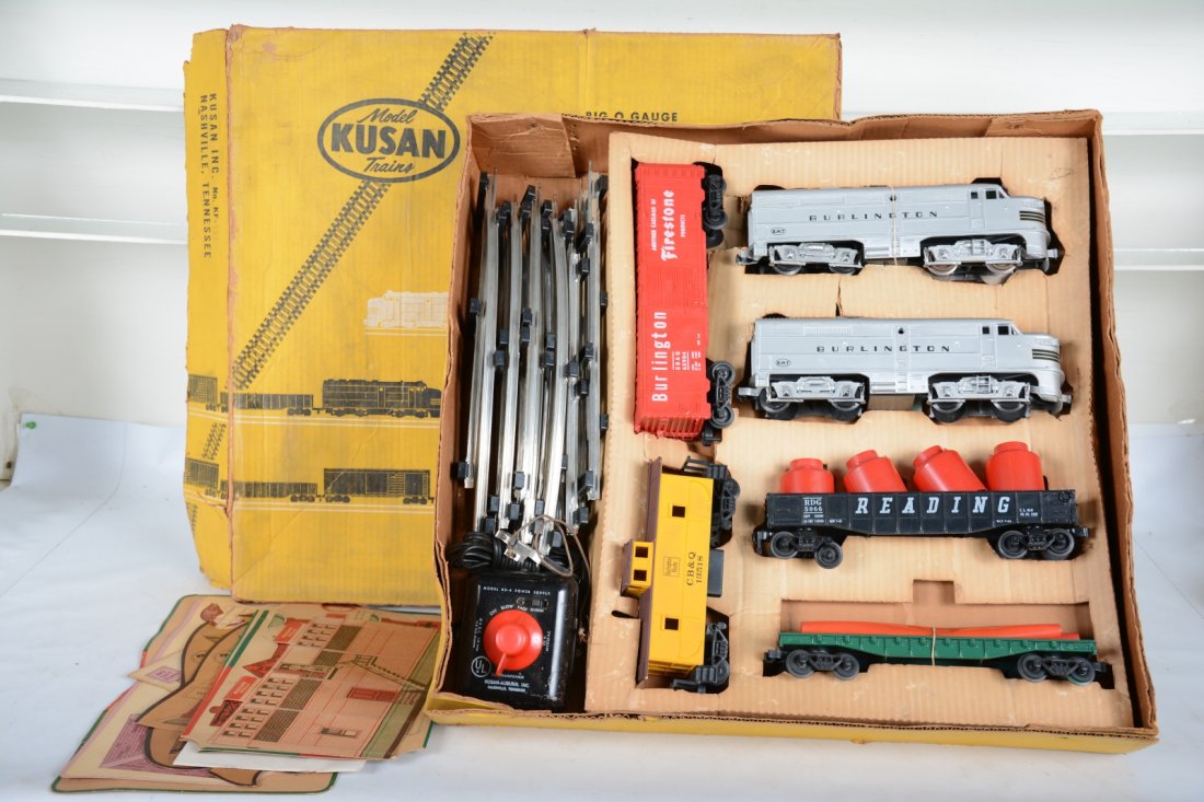 Boxed Kusan Firestone Set KF-137: Includes a Burlington F7 AA diesels, power unit needs cab screws; Reading gondola with canisters; painted flat with worn pipes; Firestone, Burlington boxcar; CB&Q caboose, track, transformer, paper cu