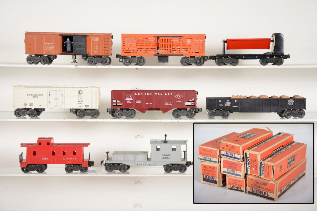 Boxed Lionel Freight Cars: Includes 3656 stock car; 3464 NYC operating boxcar; 3559 ore dump car; 6257 caboose, red; 6472 reefer; 6456 hopper; 6462 gondola with drums; 6419 work caboose. All are clean and show light playwear wi