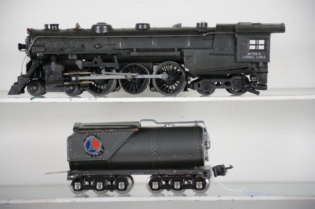 Clean Lionel Gunmetal 763E Hudson: Circa 1938. Early casting that is clean & shiny with light signs of pimpling. Running boards are slightly wavy, but no cracking visible, wheels are well lubricated and turn freely; 263W oil tender mat
