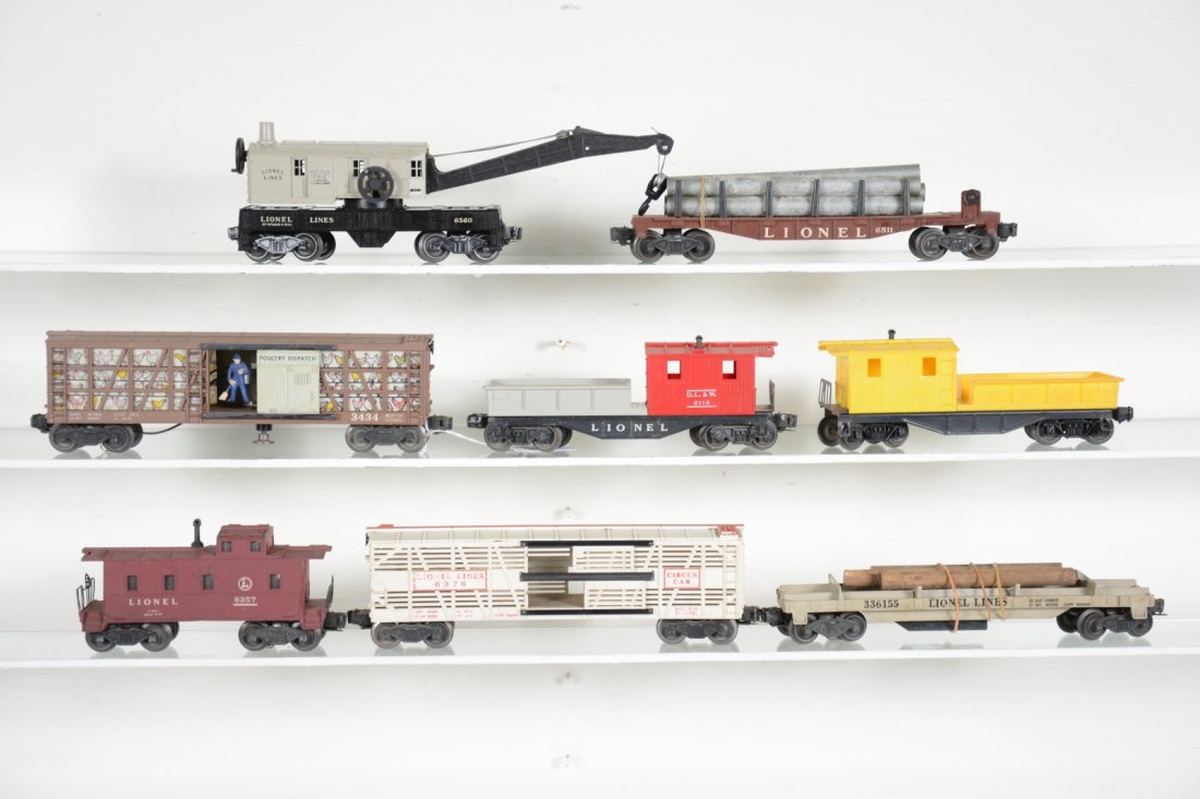 Lionel Freight Cars: Includes a 3434 operating Poultry dispatch. Blue man version; (6120) work caboose; 3361 log dump car; 6376 circus car, side lettering worn, C5; 6357 caboose; 6511 flat with pipes; 6460 crane; 6119 wor