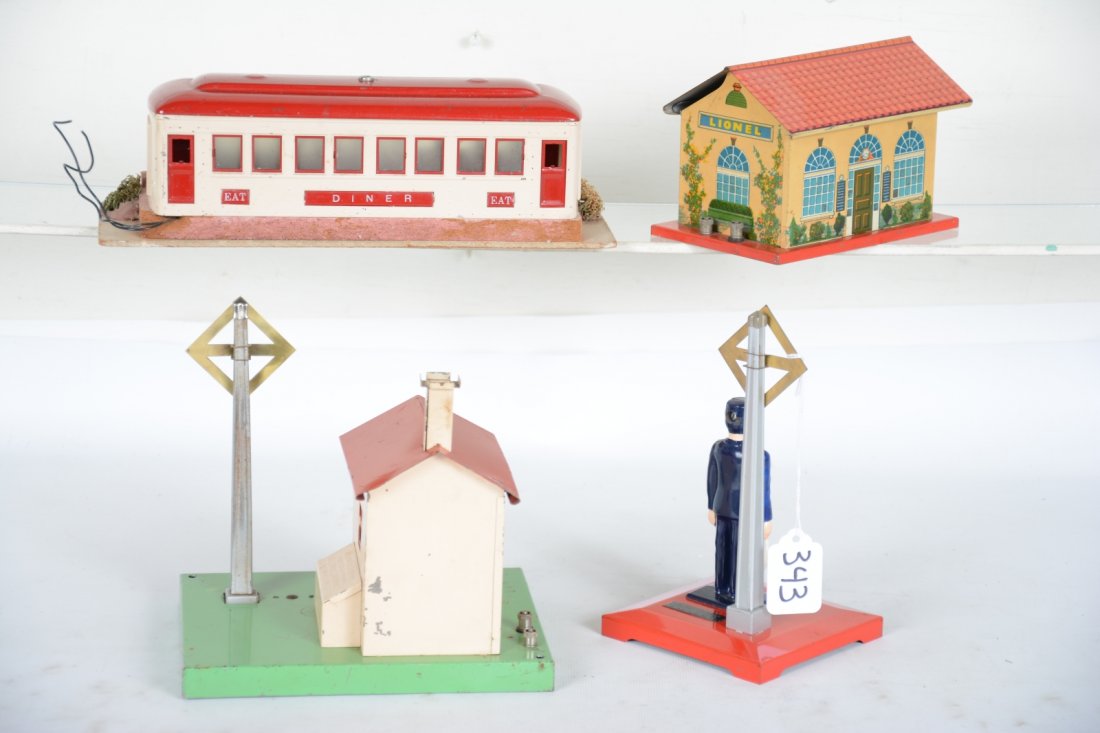 Lionel Accessories: Standard Gauge. Includes a 442 diner, 90% foliage complete with nice label; 1045 flag man; 45N gateman, figure cracked; 48W whistling station. All are fairly clean and shiny, showing light to moderate