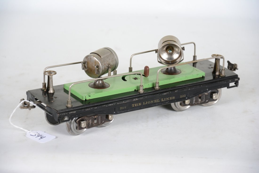 Late Lionel 220 Searchlight Car: Standard Gauge. Nice car for your work train. It is clean and shiny, showing moderate playwear with nice frame lettering, C6+