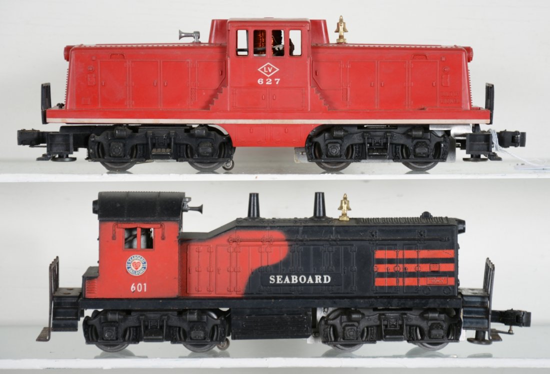 Lionel 601 & 627 Diesels: Includes a 601 Seaboard NW2 diesel with horn, small screw chip, but cab holds securely; 627 LV 44 ton diesel with nice stripe. They could benefit from a cleaning and show light to moderate playwear, o