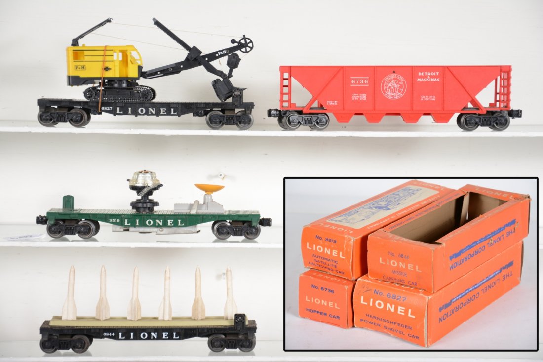 Boxed Lionel 6844, 6827, 6736 & 3519 Freights: Includes a 6827 flat with P&H shovel, missing 2 top pieces; 3519 satellite launcher; 6736 D&M quadhopper; 6844 missile flat. All could benefit from a cleaning, but only show light to moderate playwear