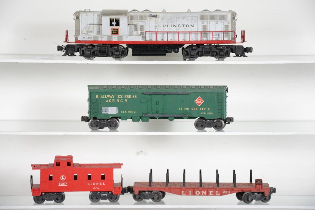 Lionel 2328 Diesel Freight Set: Includes a 2328 Burlington GP7 diesel, fairly clean shell and frame with good battery box. Has touch-up spot on cab roof, C6-; 6511 empty flat; 6572 REA reefer; 6257-25 caboose. All show light to mode