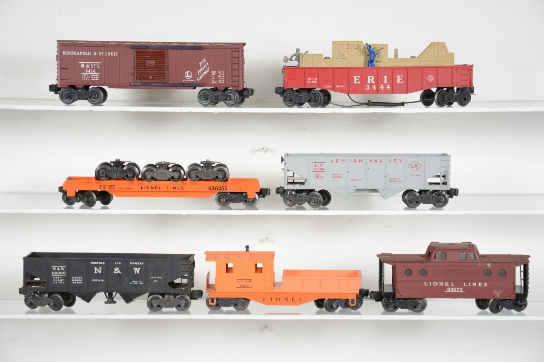 Lionel Freight Cars: Includes a 3444 cop & hobo car; 6464-50 M&StL boxcar, type I; 6362-555 truck car; dusty 6427 caboose; 6456-25 LV hopper, C6; dirty 3456 N&W operating hopper; 6119-25 work caboose. Rest show light play