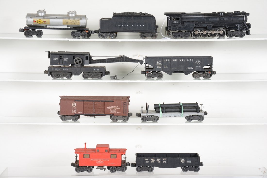 Large Lionel 671 Steam Freight Set: Includes a 671 steam turbine, missing nose decal, but smoke bulb version; 2466WX tender; 2465 Sunoco tank car; 2420 crane; 2411 flat with repro pipes; 2452 PRR gondola; 2458 PRR boxcar; 2456 LV hopper