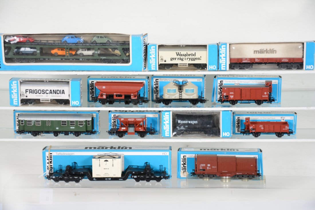 Boxed Marklin HO Rolling Stock: Includes 4074 auto-loader; 4445 tank car; 4531 reefer; 4475 covered wagon; 4695 goods wagon; 4610 ballast; 4618 flat with crate; 4663 coil car; 4661 chemical tank; 4566 reefer; 4631 hopper; 4080 posta