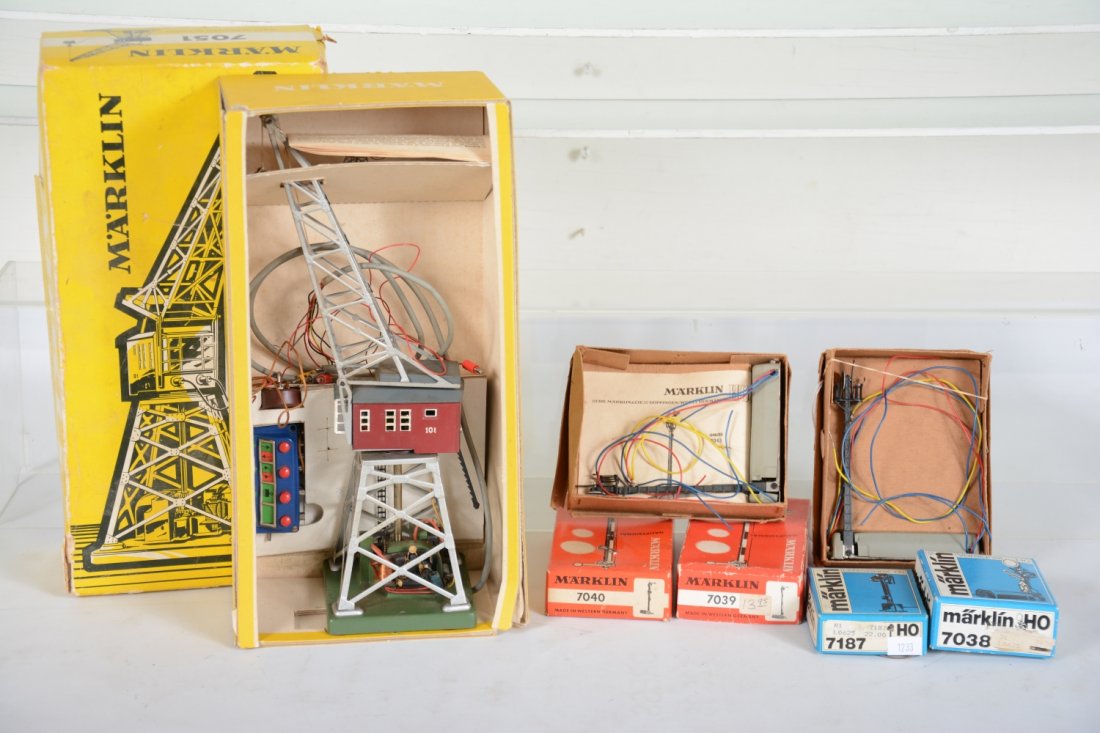 Marklin HO Accessories: Includes a 7051 magnetic crane; 2 #7043 flag signals; 7038 flag/target signal; 7187 double block signal; 7039 semaphore; 7040 double semaphore. All show light use with most peripherals and boxes, C8+-