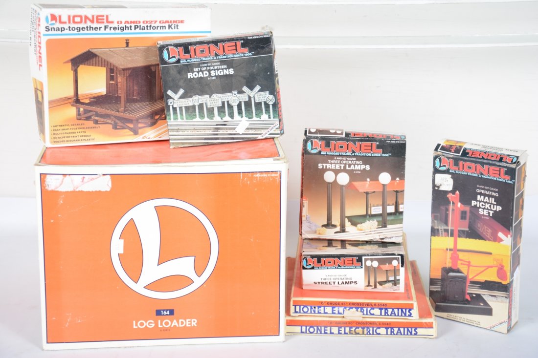 Lionel Modern Accessories: Includes a 12915 #164 log loader, C7; 5540 cross; 5545 cross; 12729 mail pick-up; 2784 Freight station; 2 #12708 lights; 2180 road signs. Rest show light use with boxes, C8-9