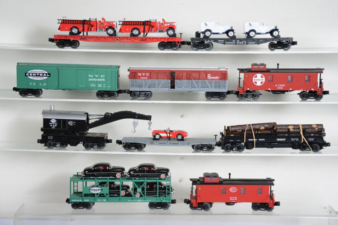 MTH Rolling Stock: Includes NYC auto-loader with 1949 Mercury's; SF & NYC wood side cabooses; NP log dump car; Columbia flat with fire trucks; C&O flat with 1932 Fords; NYC boxcar; NYC Stock car; NYC flat with Corvette;