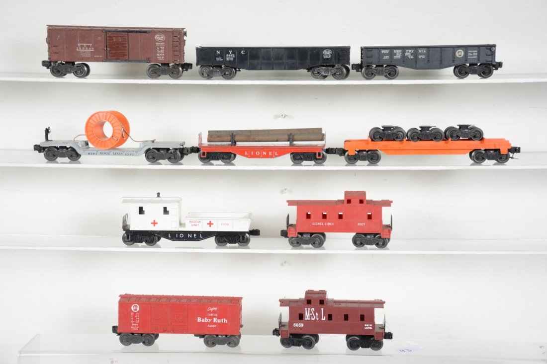 Lionel Postwar Rolling Stock: Includes 6454 NYC boxcar; 6462 gondola; 6461 reel car, missing 1 reel; 6814 JC Penney rescue caboose, repaired cab corner; 6111 log flat; 6014BR boxcar; 2452 PRR gondola; 6362 truck car, lettering lig