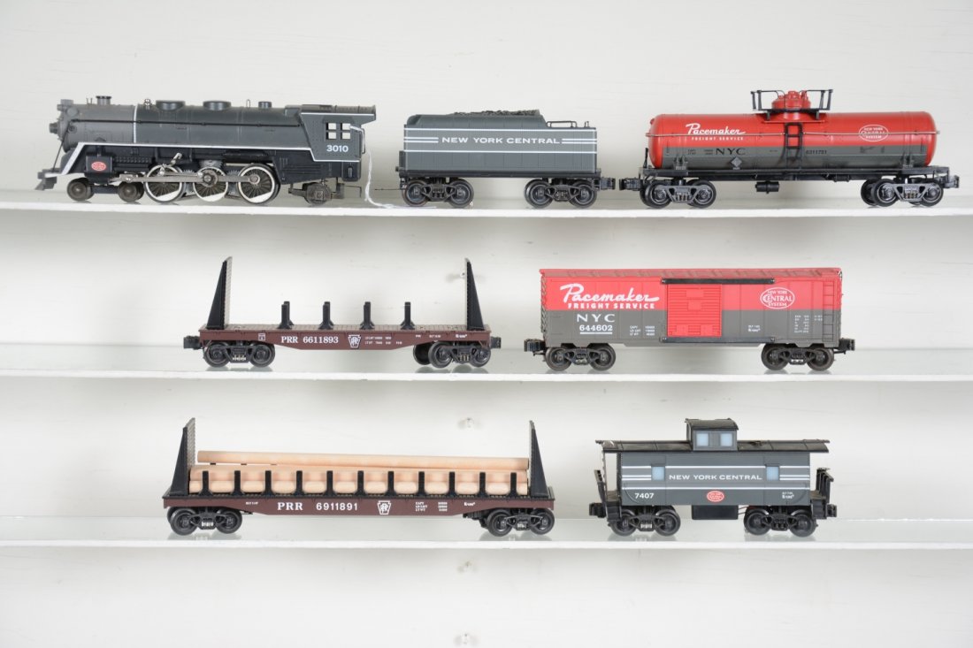 K-Line NYC Steam Freight Set: Includes a 4-6-2 cast steam loco with whistling tender; PRR flat car; NYC Pacemaker boxcar; NYC tank car; 60' PRR log flat; NYC smoke caboose, missing stack. Rest are a bit dusty, but only show light 