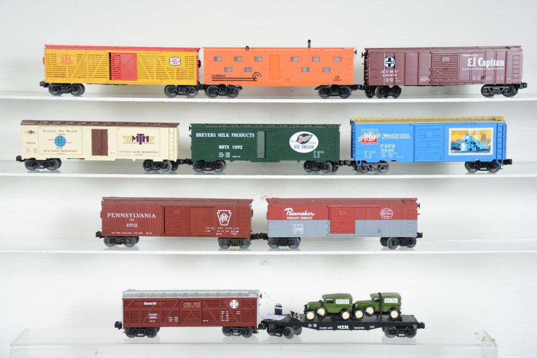 MTH Freight Cars: Includes flat with bakery vans; SF stock car; Pacemaker NYC boxcar; PRR boxcar; USPS boxcar, C7; Breyers reefer; SF El Capitan boxcar; Conrail bunk car; GAC stock car; MTHRRC boxcar. Rest show light r