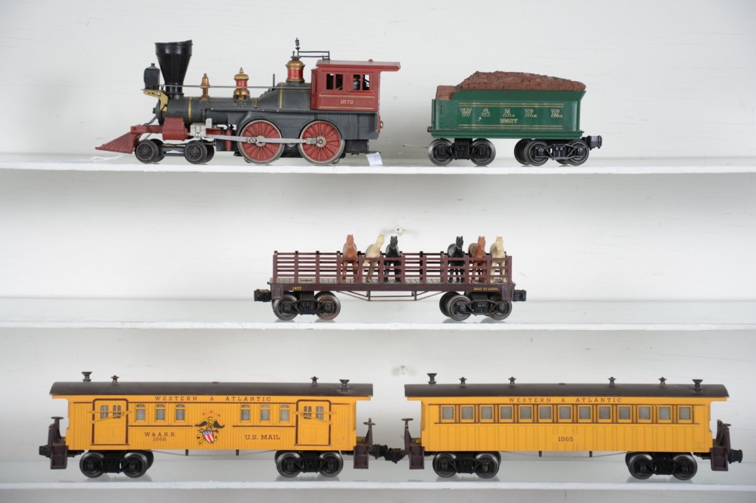 Lionel 1872 General Set: Includes an 1872 General loco with smoke, missing 2 trim pieces at steam chests with instructions; 1862T tender; 1866 baggage, roof end chipped; 1865 coach; 1877 flat with horses. All are dusty and sh
