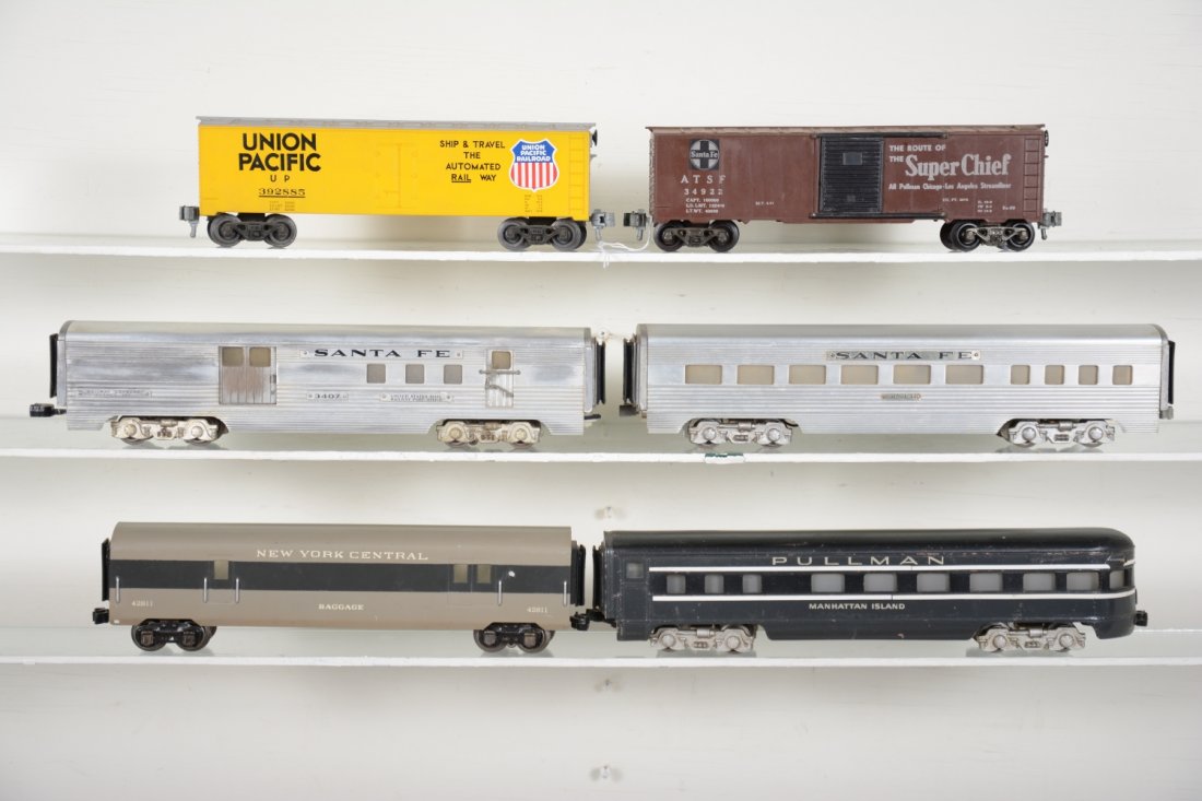 KMT & Miscellaneous Modern Cars: Includes a KMT SF boxcar; 3407 SF RPO; SF diner; UP reefer; KMT color catalog; Cast NYC observation , frame repaired; Tin NYC baggage with tinplate trucks. All show light to moderate playwear, rest C6