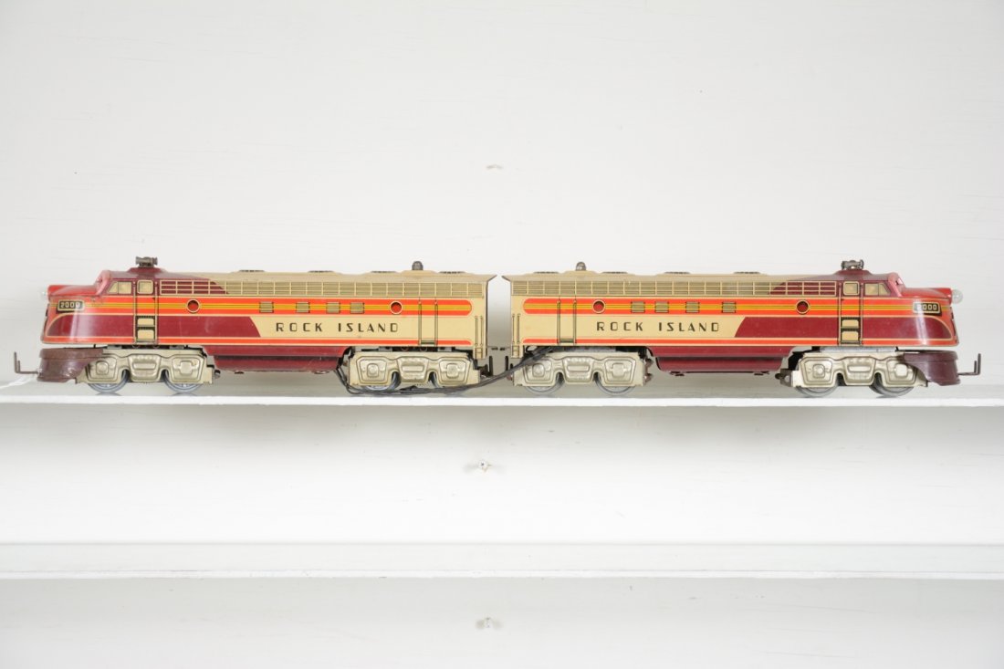 Unique Art RI Diesels: Interesting litho tin O gauge electric 3-rail units. They have an unusual coupler with no cars made to go with it. They are clean, but has a wire tether, not original, probably to illuminate the dummy