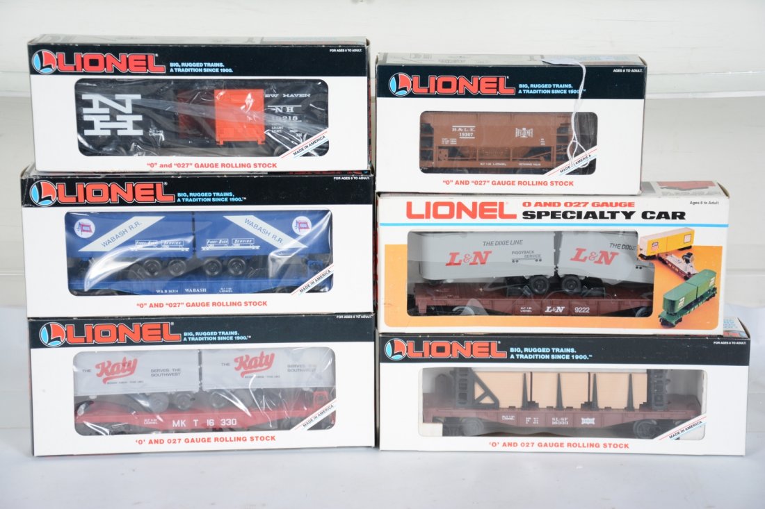 Lionel Freight Cars: Includes 19307 BLE ore car; 9222 L&N flat with trailers; 16333 Frisco flat car; 16314 Wabash flat with trailers; 16330 MKT flat with trailers; 19218 NH boxcar. All appear new in boxes, C10