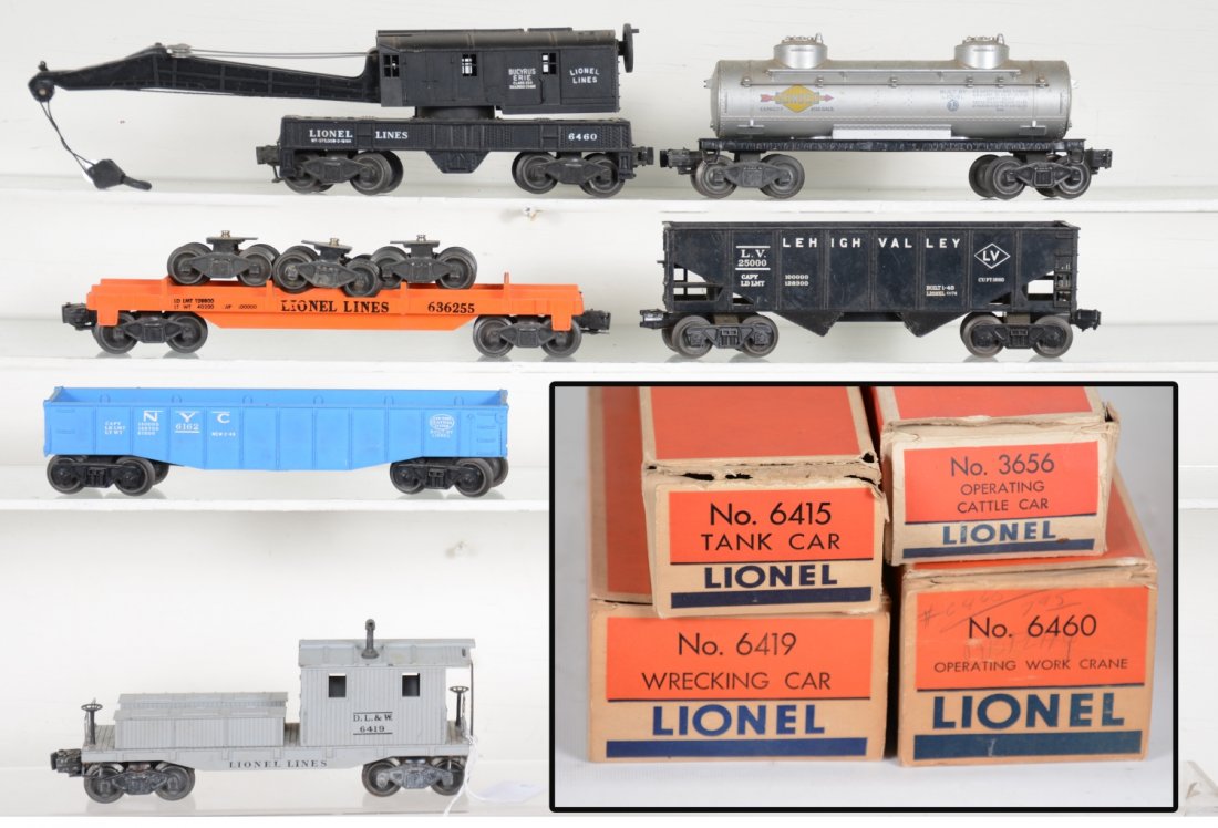 Lionel Freight Cars and Boxes: Includes a boxed 6460 crane; boxed 6419 work caboose, hairline crack in roof corner; 6362-55 truck car; 6076 hopper; 6162 gondola; 6465 tank car; empty boxes 6415 & 3656 car. Trains show light to mode