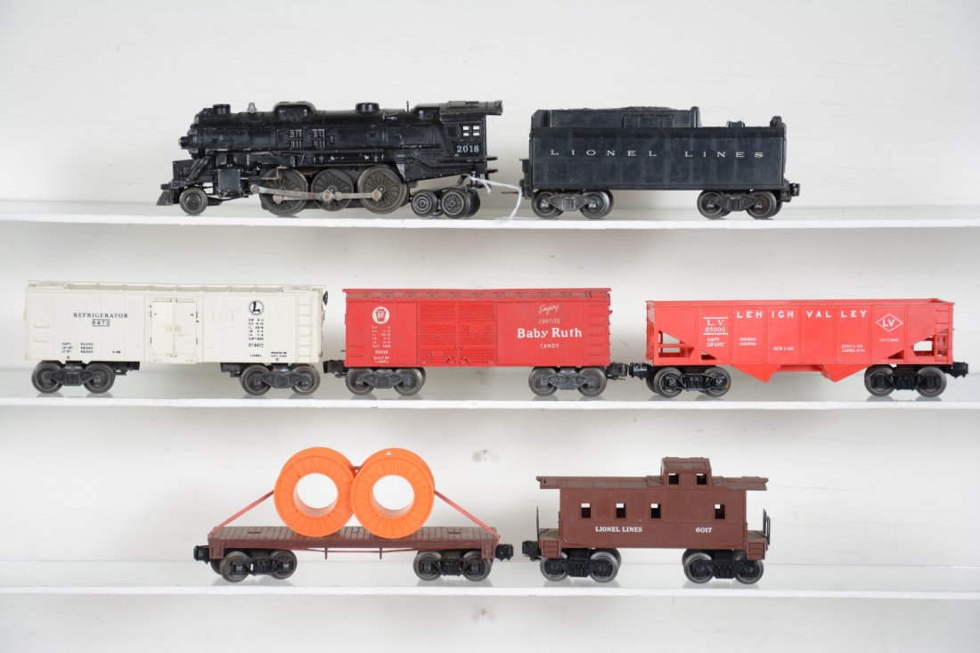 Lionel 2018 Steam Freight Set: Includes a 2018 steam loco, missing 1 running light; 6026T tender; 6076 hopper; 6014 BR boxcar; 6472 reefer; 6401 flat with reels; 6017 caboose. All show light to moderate playwear, otherwise C6-7