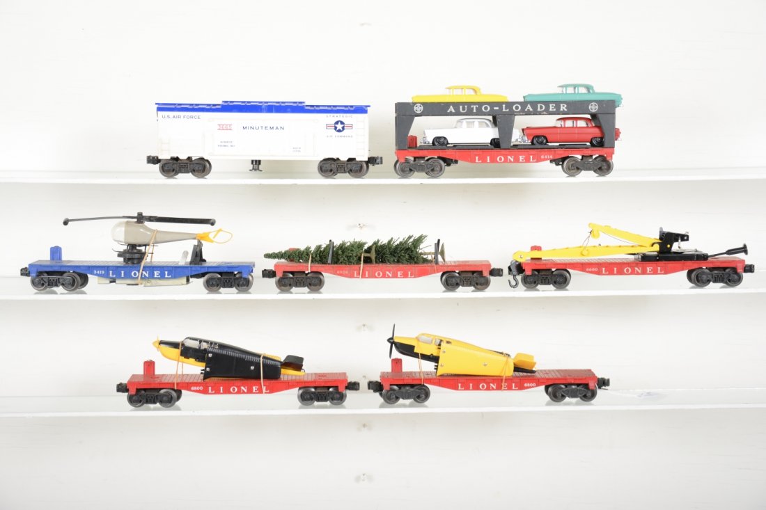 Lionel Rolling Stock: Includes a 6414 auto-loader; 2 different 6800 flats with airplanes; 6826 flat with Christmas trees; 3419 helicopter car; 6670 flat with derrick; 3665 Minuteman missile launcher. All are clean with rep