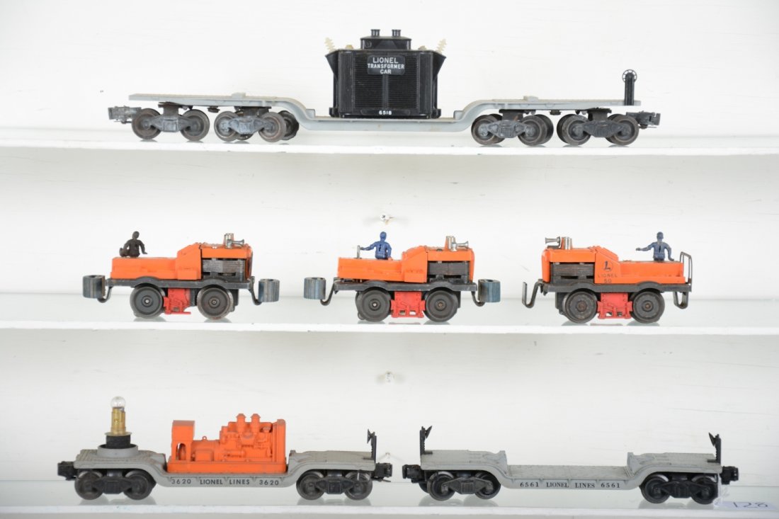 Lionel Lot: Includes 3 #50 gang cars; 6518 flat with transformer; 6561 reel car; 3620 searchlight, all fairly clean but missing some pieces, some glue residue on gang cars, C5-6