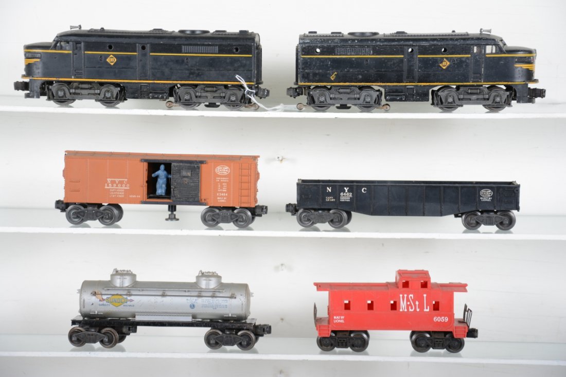Lionel 2031 Double Diesel Freight Set: Includes a 2031 Erie Alco AA Diesels, battery box is clean, decals about 60% over-all; 6462 gondolas; 3464 NYC operating boxcar; 6465 tank car; 6059 M&StL caboose, all show moderate playwear, rest C6