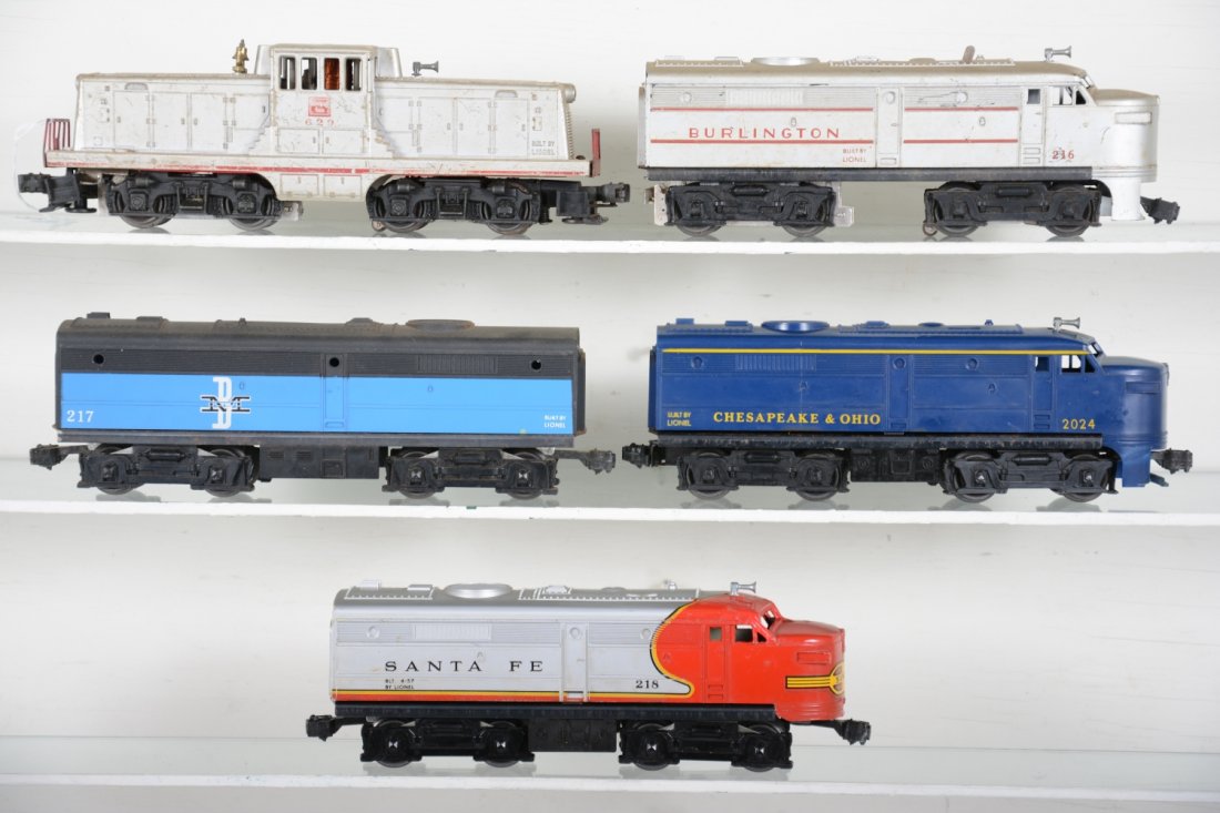 Lionel Diesel Lot: Includes a 629 CB&Q 44-ton diesel, C4; 216 Burlington Alco , broken cowl; 217C B&M B-unit, C7; 2024 C&O Alco on dummy frame, broken cowl; 218 SF Alco on dummy frame, full lower cowl & skirts missing. 
