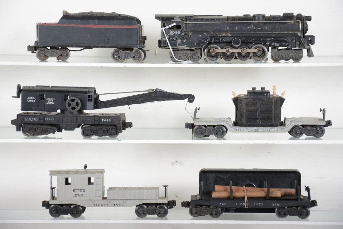 1948 Lionel 2020 steam Freight Set (1447WS): Includes a 2020 turbine loco, missing rear steps, C5; 6020W tender, shell repainted; 3451 log dump with load & bin; 2460 crane, missing 1 wheel set, crack in boom support; 2461 flat with transformer,
