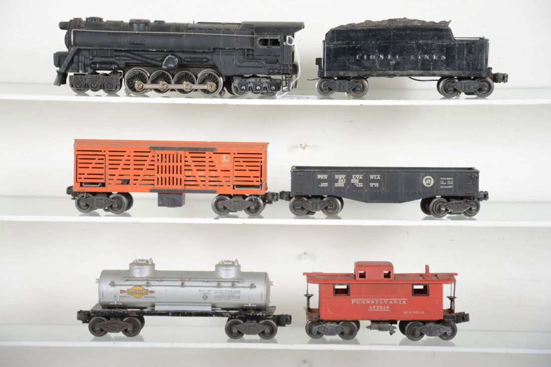 Lionel 671 Steam Freight Set: Includes a 671 steam turbine, clean, but no cab lettering; 671W tender; 3656 operating stock car, no pen, small chip in catwalk; 2452 gondola; 6465 tank car; 2457 caboose, stack incomplete. All otherw