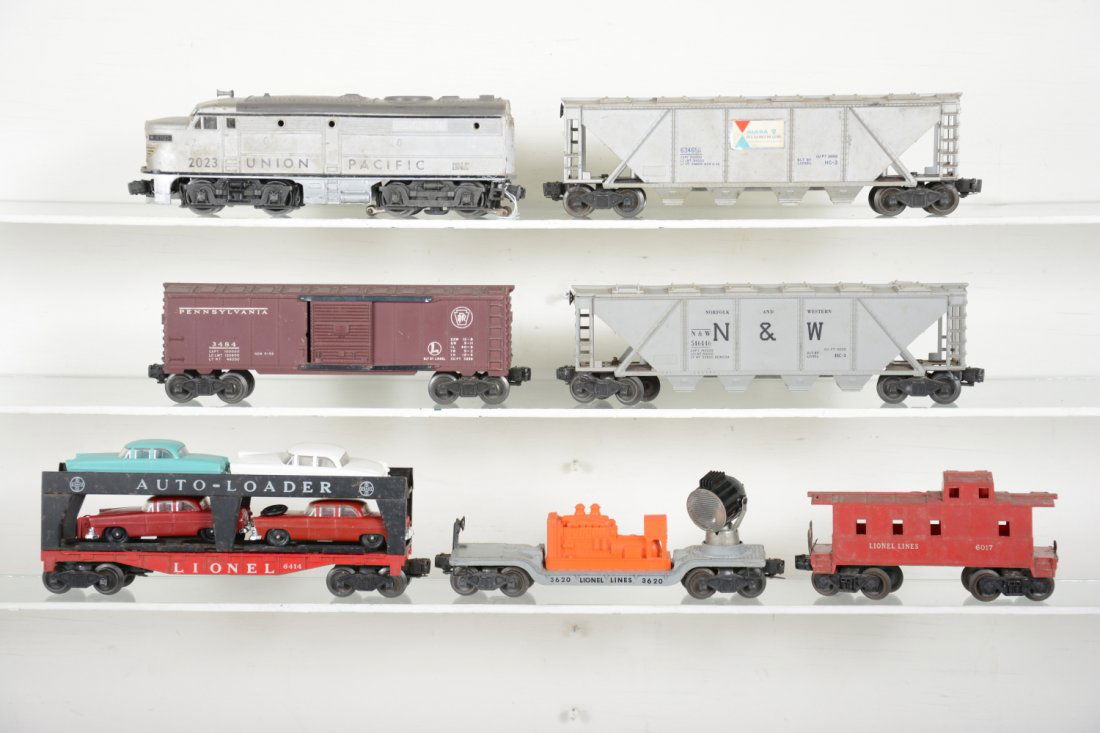 Lionel Diesel Freight Set: Includes a 2023 UP Alco diesel, some mildew residue; 3484 PRR operating boxcar, no plunger; 6346 Alcoa quadhopper, 1 replaced hatch; 6414 auto-loader, replaced cars; 6446-54 N&W quadhopper; 3620 searc