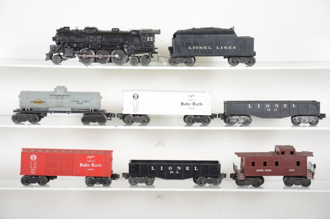Lionel 2026 Steam Freight Set: Includes a 2026 steam loco, 6466W tender, 6066T shell; 6025 tank car; 6014 BR boxcar; 6032 gondola; 6014 BR boxcar; 6012 gondola; 6037 caboose. All show moderate playwear, C6-7