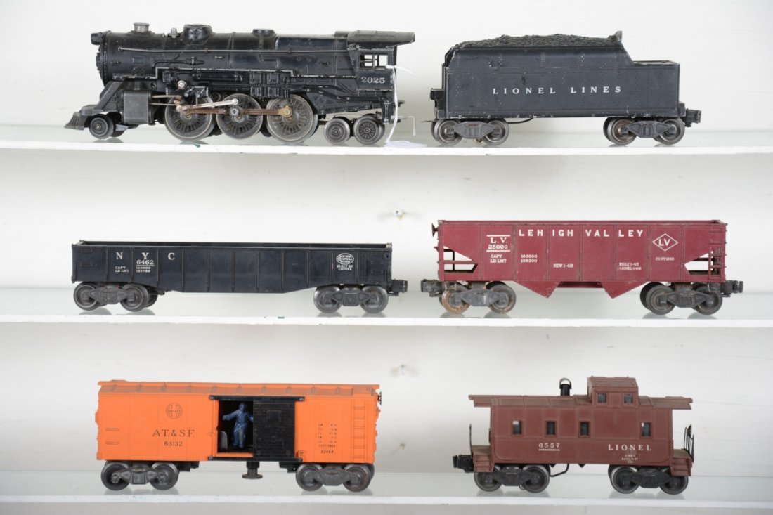 Lionel 2035 Steam Freight Set: Includes a 2035 loco; 6466WX tender; 6462 gondola; 6456 LV hopper; 3464 SF operating boxcar; 6657 smoke caboose, 1 broken step. Rest show moderate playwear, C6